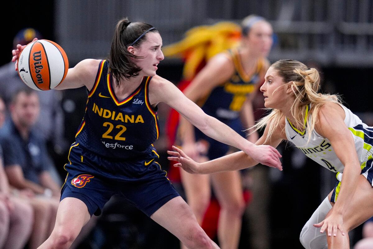 Dallas Wings guard Jacy Sheldon (4) defends Indiana Fever guard Caitlin Clark (22) in the first half of a WNBA basketball game in Indianapolis on Sept. 15, 2024. (Michael Conroy/AP Photo)