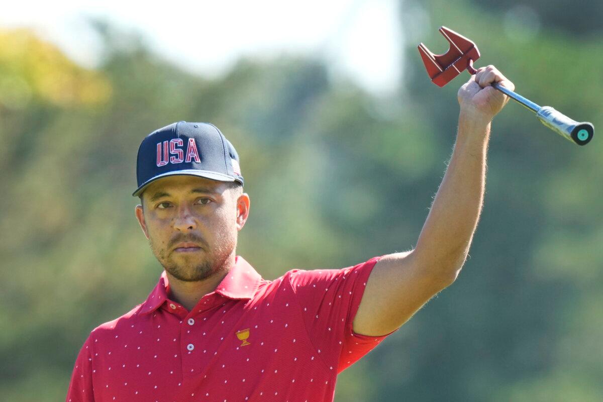 U.S. team member Xander Schauffele reacts after making a birdie on the first hole during their fifth round singles match at the Presidents Cup golf tournament at Royal Montreal Golf Club in Montreal on Sept. 29, 2024. (Frank Gunn/The Canadian Press via AP)