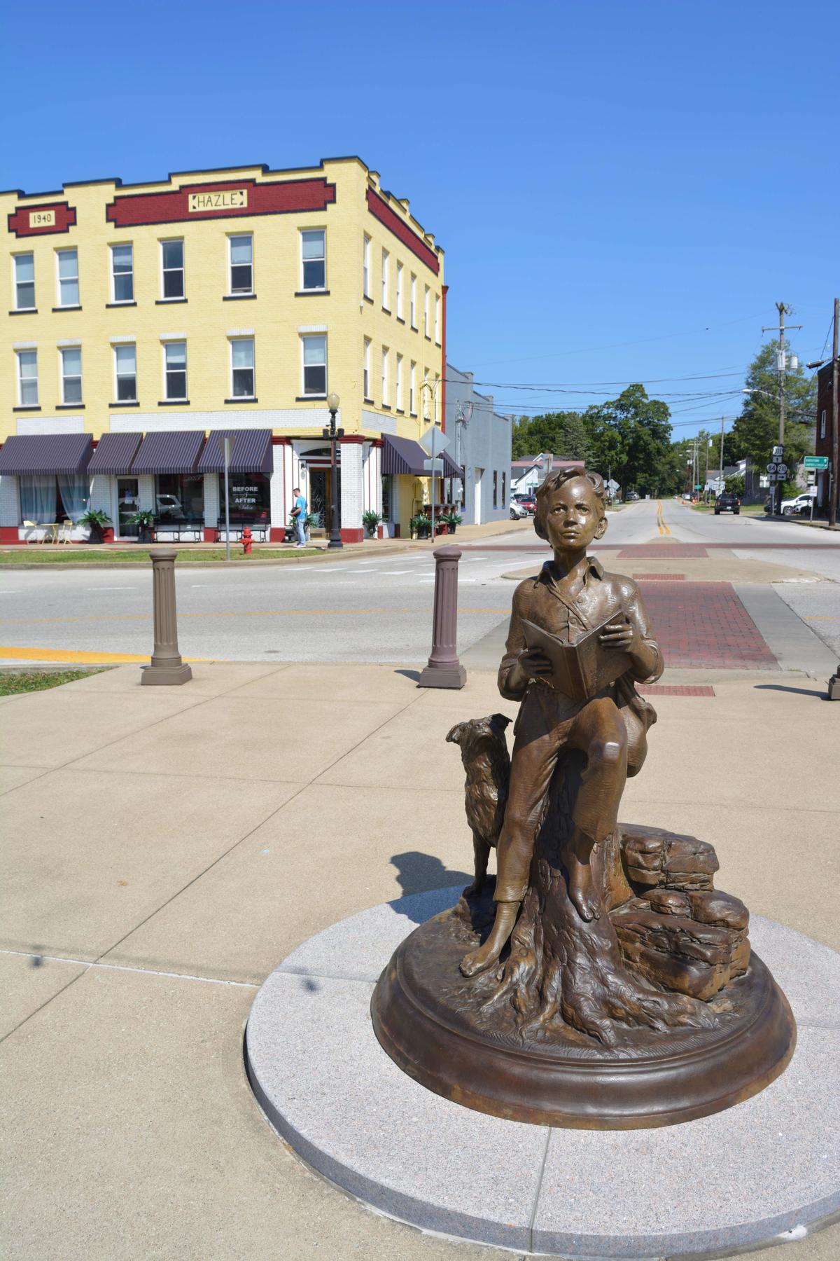 The statue of a boy Lincoln gazes up at his adult counterpart, in Hodgenville, Ky. (Deena Bouknight)