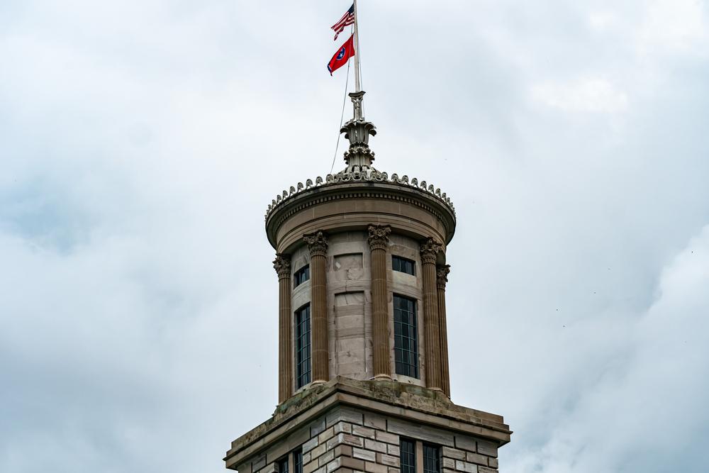 The Capitol’s 80-foot-tall tower includes a 37-foot cupola with a finial, inspired by the Greek Lysicrates monument in Athens. Eight columns are topped with capitals sporting acanthus and lotus leaf designs. The wrought-iron finial crown at the very top of the tower has a four-tier leaf design culminating in a flag pole. The cupola is mounted on a cut-stone pedestal. (RebeccaDLev/Shutterstock)