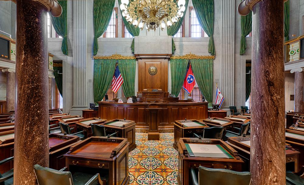 The gallery in the Senate chamber (located on the Capitol’s second floor) is supported by 12 solid marble columns topped with entablature with classical designs. A polished semicircle wood rostrum is accentuated by a polished wood backdrop featuring the Tennessee state seal. (<u><a href="https://commons.wikimedia.org/wiki/User:Antony-22">Antony-22</a>/<a href="https://creativecommons.org/licenses/by-sa/4.0">CC BY-SA 4.0</a>)</u>