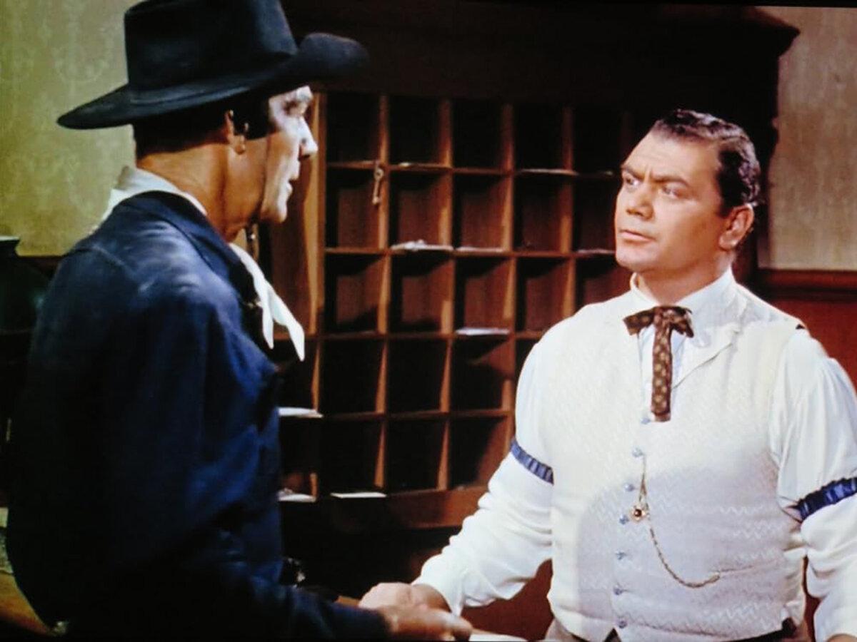 Jim Kipp (Randolph Scott) notices the limp of Bill Rachin (Ernest Borgnine), in “The Bounty Hunter.” (Warner Bros.)