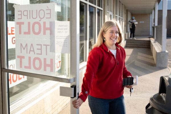 New Brunswick Liberal Party Leader Susan Holt, holds the door for volunteers leaving her headquarters to knock on doors in her riding in Fredericton, N.B., on Oct. 19, 2024. (The Canadian Press/Darren Calabrese)