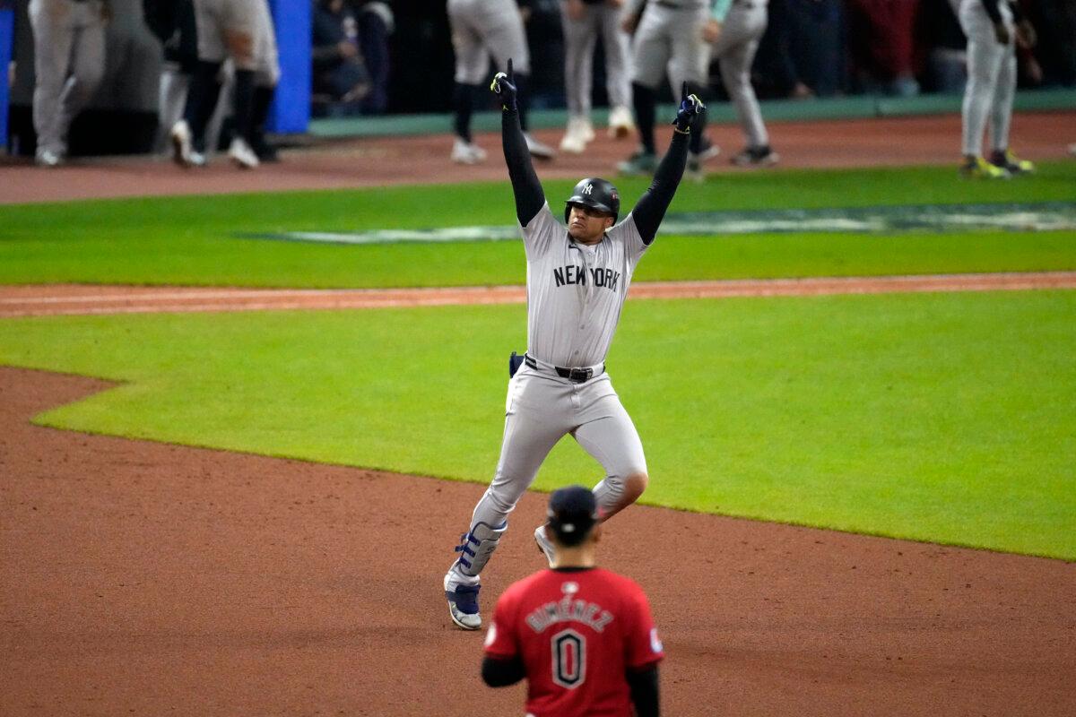 New York Yankees' Juan Soto celebrates after hitting a three-run home run against the Cleveland Guardians during the 10th inning in Game 5 of the baseball AL Championship Series in Cleveland, Ohio, on Oct. 19, 2024. (Jeff Roberson/AP Photo)