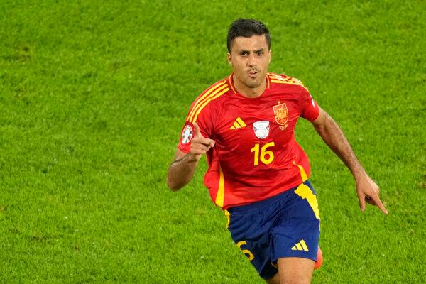 Spain's Rodri celebrates after scoring his side's opening goal during a round of sixteen match against Georgia at the Euro 2024 soccer tournament in Cologne, Germany, on June 30, 2024. (Andreea Alexandru/AP Photo)