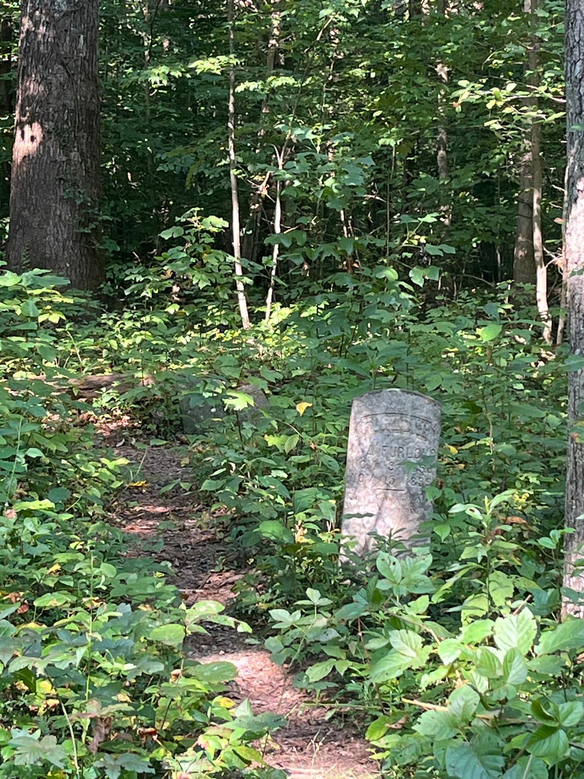 A cemetery along the Mammoth Cave Rail Trail reminds visitors of the years of history beneath their feet. (Deena Bouknight)