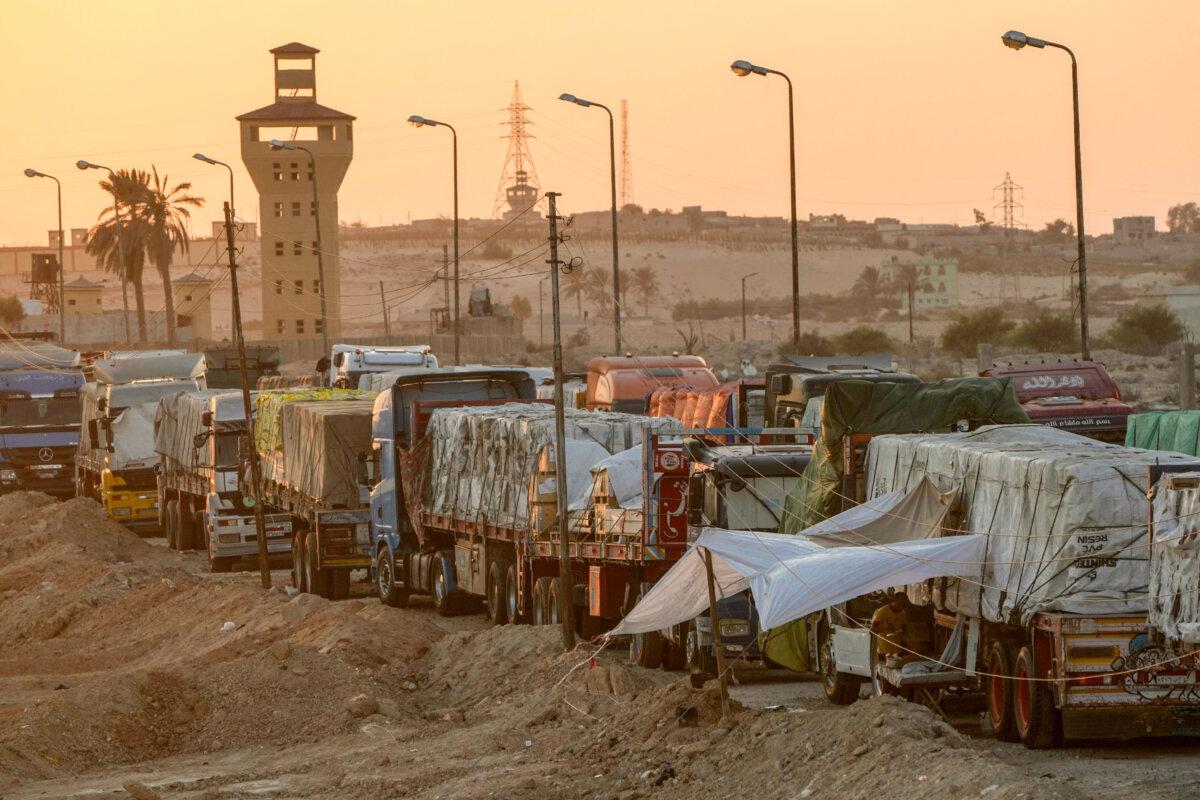 Trucks of humanitarian aid wait to cross the Rafah border crossing between Egypt and the Gaza Strip, in Rafah, Egypt, on Sept. 9, 2024. (Amr Nabil/AP Photo)
