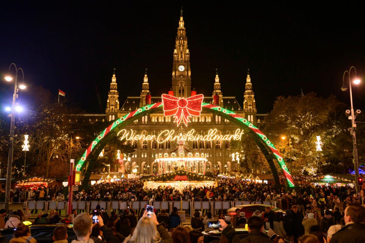 People look at the illuminations at the Wiener Chritkindlmarkt in front of Vienna's city hall, one of Vienna's most popular Christmas markets, in Vienna, Austria, on Nov. 16, 2024. (Christian Bruna/AP Photo)