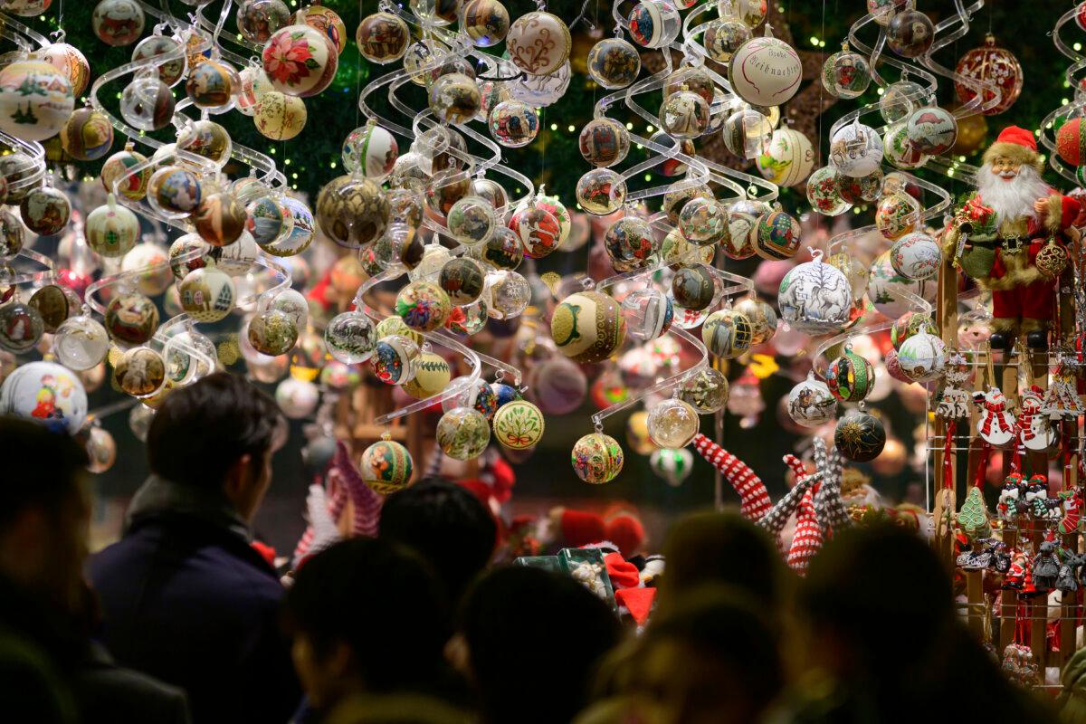 People look at the illuminations at the Wiener Chritkindlmarkt in front of Vienna's city hall, one of Vienna's most popular Christmas markets, in Vienna, Austria, on Nov. 16, 2024. (Christian Bruna/AP Photo)