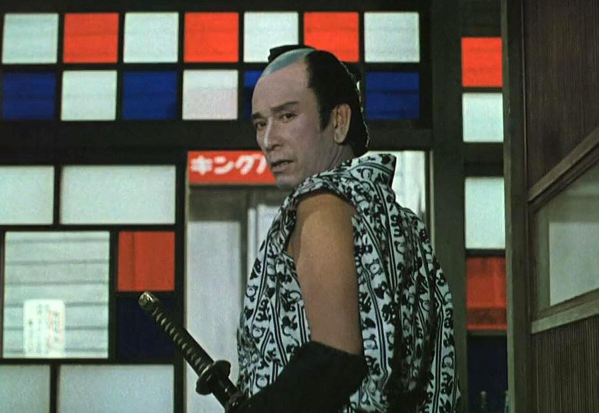 Kichinosuke (Koji Mitsui) checks out one of his “picks,” in “Floating Weeds.” (Daiei Film).