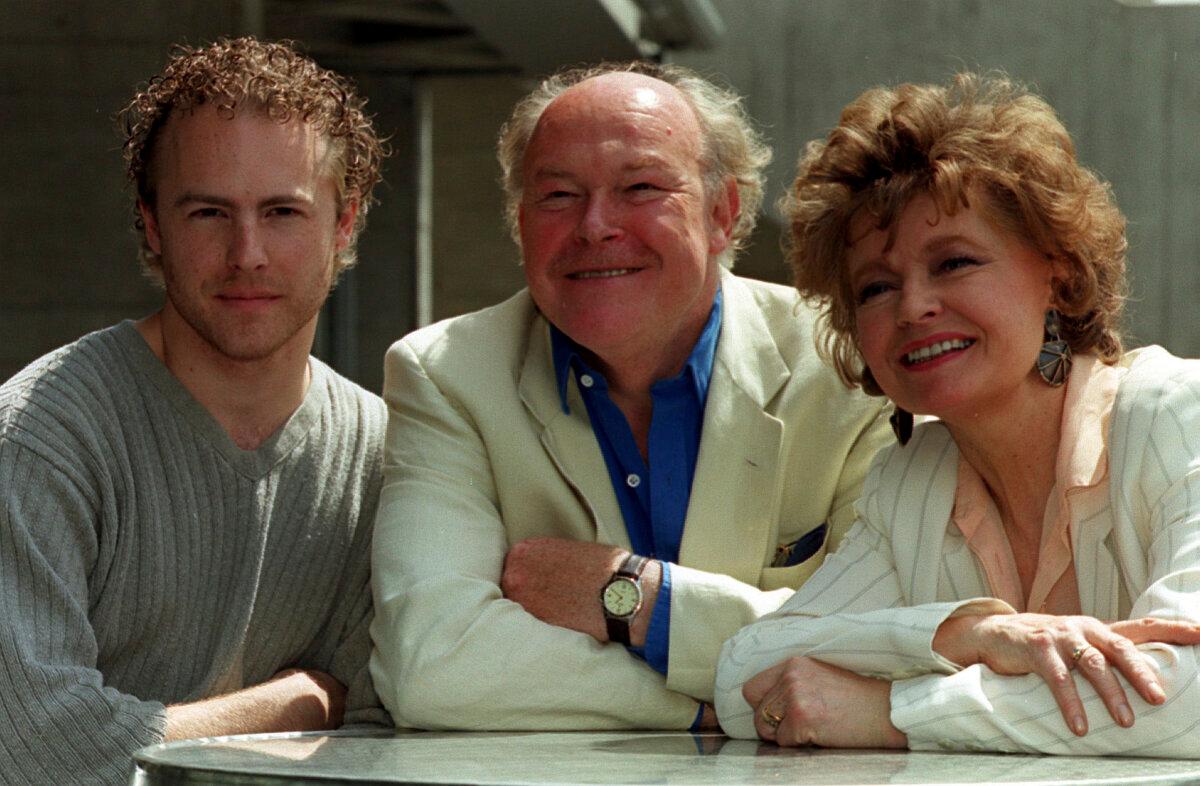 From left, actors Sam West, his father, Timothy West, and his mother, Prunella Scales, during a photocall in London on July 15, 1999. (Michael Crabtree/PA via AP)