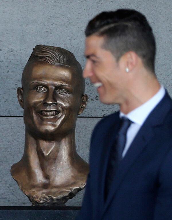 Real Madrid's Cristiano Ronaldo stands next to a bust of himself at the Madeira international airport outside Funchal, the capital of Madeira island, Portugal, on March 29, 2017. (Armando Franca/AP Photo)