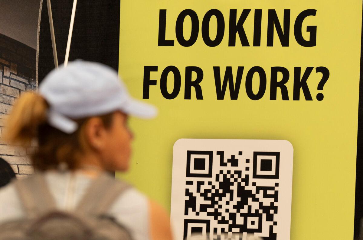 People attend a job and continuing education fair in Montreal, on Oct. 5, 2023. (The Canadian Press/Christinne Muschi)