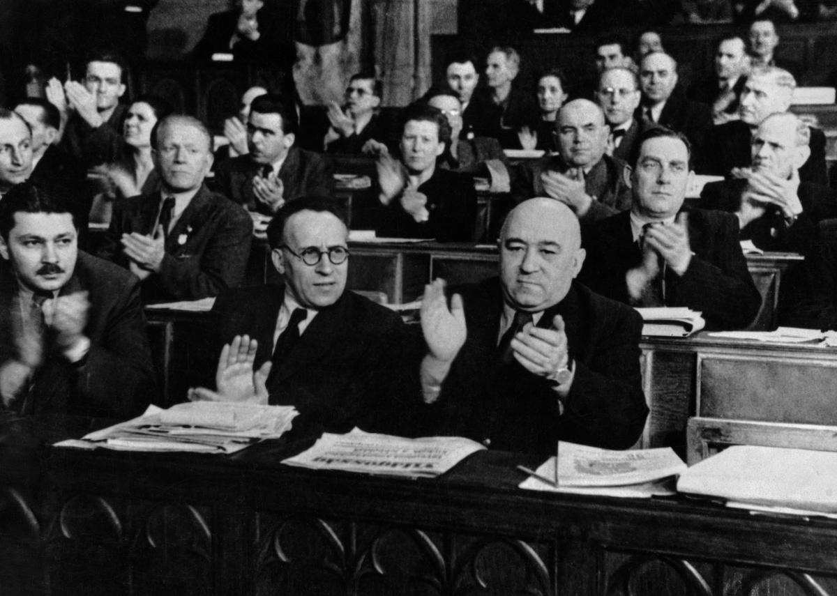 General Secretary of the Hungarian Communist Party, Matyas Rakosi (front row, 1st right), applauds merging the Social Democrats with the Communists, forming the Hungarian Working People's Party (MDP) in March 1948. (Archive Photos/Getty Images)