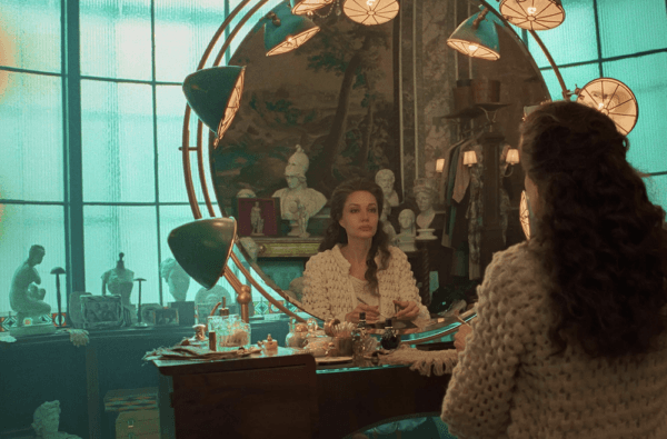 Maria Callas (Angelina Jolie) in front of her make-up mirror, preparing for an outing, in "Maria." (Netflix)