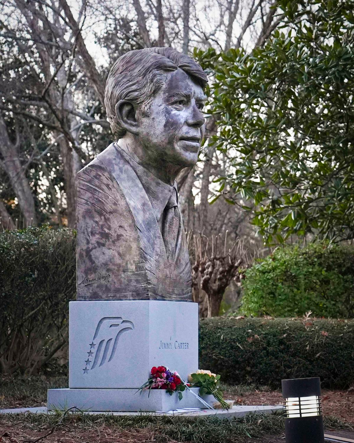 Day in Photos: Jimmy Carter Dies at 100, Plane Crash in South Korea, and Unrest in Valencia