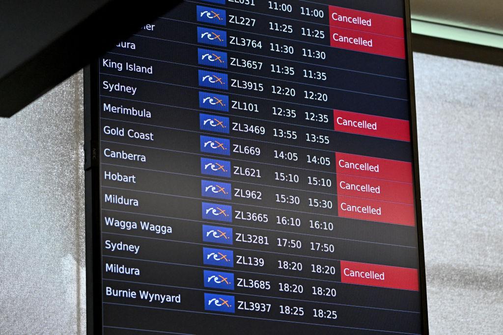 A screen shows cancelled Rex Airlines flights at Melbourne's Tullamarine Airport on July 31, 2024. (William West/AFP via Getty Images)
