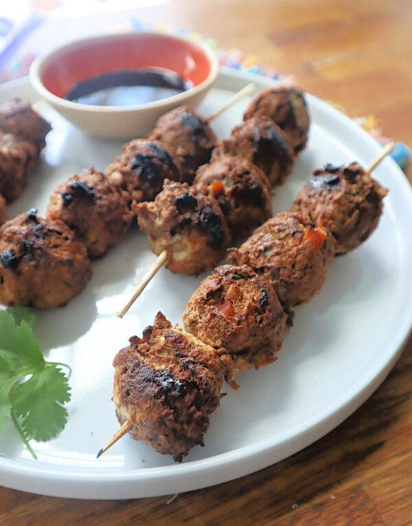 The secret to these tsukune, a traditional yakitori dish of lightly seasoned and grilled chicken meatballs, is the addition of Chinese yam. (Gretchen McKay/Pittsburgh Post-Gazette/TNS)
