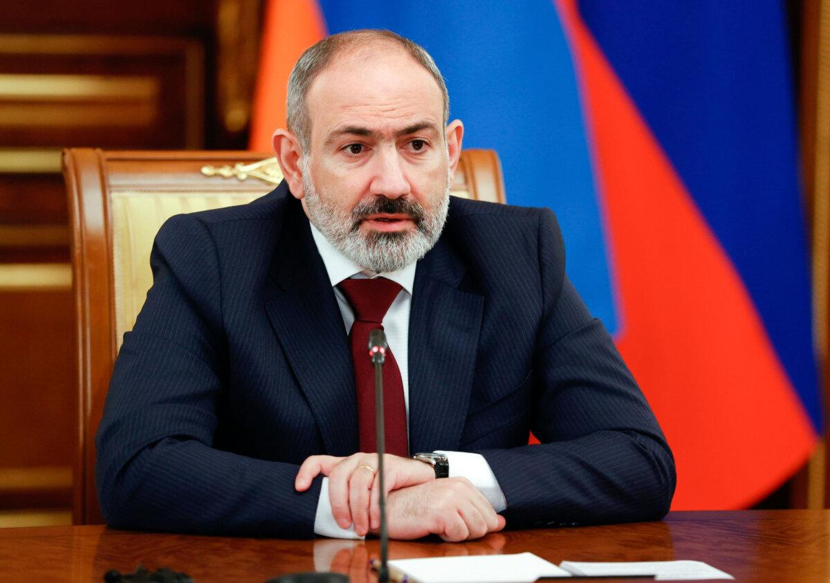 Armenian Prime Minister Nikol Pashinyan speaks to Russian Prime Minister Mikhail Mishustin during talks in Moscow on April 20, 2022. (Dmitry Astakhov, Sputnik via AP)