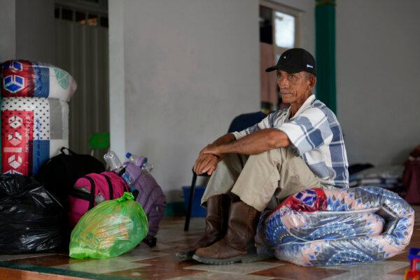 Jose Mejia sits inside a shelter for people displaced following guerrilla attacks that have killed dozens of people and forced thousands to flee their homes in Tibu, Colombia, on Jan. 21, 2025. (Fernando Vergara/AP Photo)