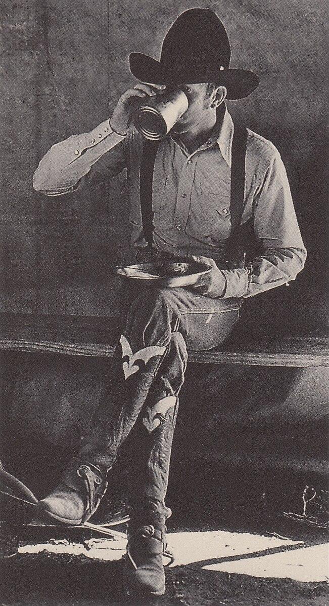 It's a good day to sit and eat some grub, as this Texas cowboy does in a 1979 photograph published by the Dallas Times Herald. (Public Domain)