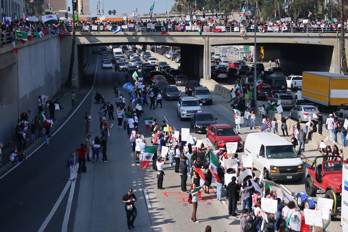 Los Angeles Protesters Block Freeway, Spray Graffiti, Vandalize Car