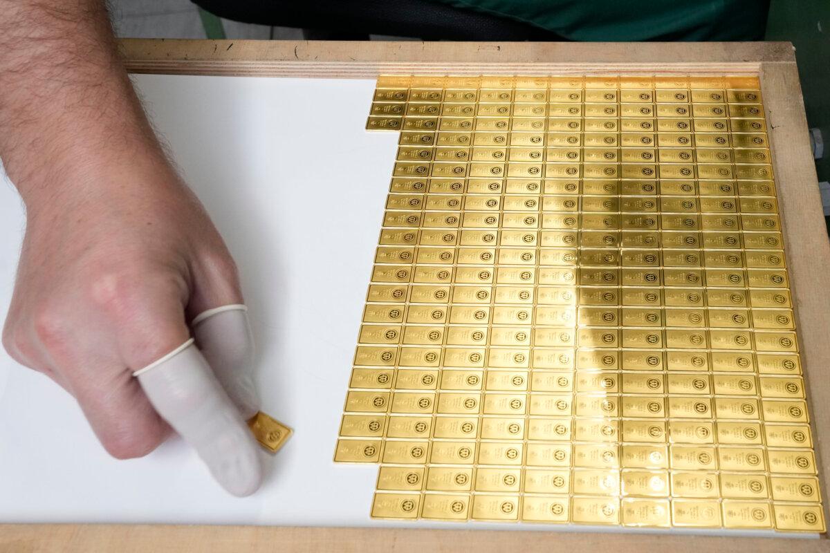 Investment gold bars are arranged for storage at the Mint of Poland, in Warsaw, Poland, on June 25, 2024. (AP Photo/Czarek Sokolowski)