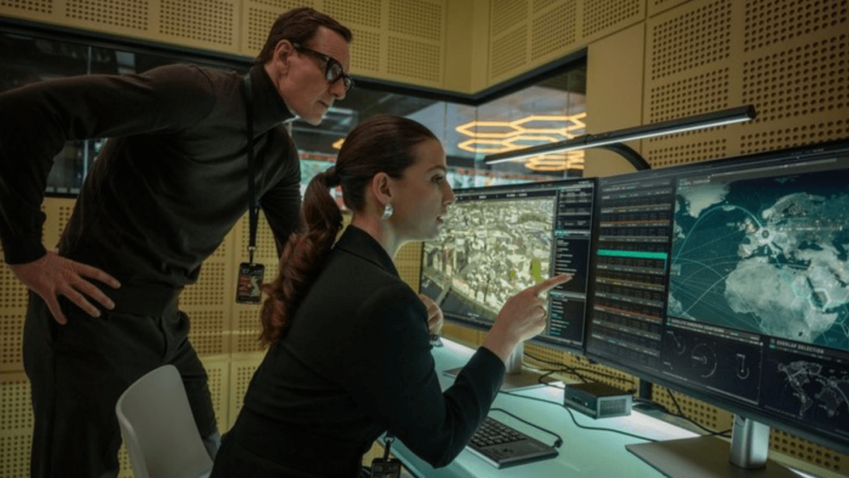 George Woodhouse (Michael Fassbender) and Clarissa (Marisa Abela) re-task a satellite, in "Black Bag." (Focus Features)