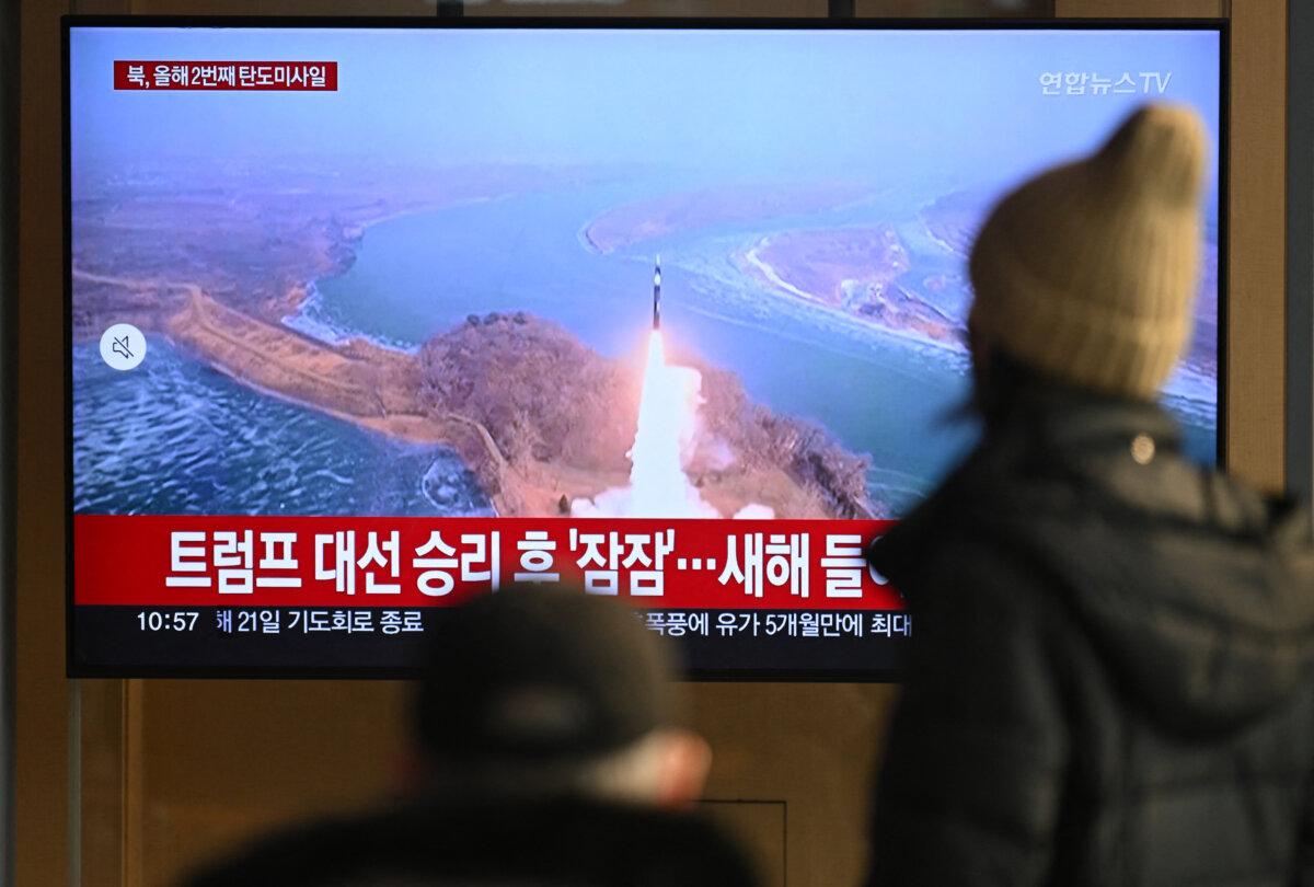 People watch a television screen showing a news broadcast with file footage of a North Korean missile test, at a train station in Seoul, South Korea, on Jan. 14, 2025. (Jung Yeon-JeAFP via Getty Images)