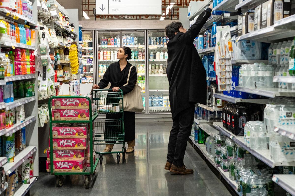 People shop at a grocery store in New York City on March 12, 2025. (Samira Bouaou/The Epoch Times)