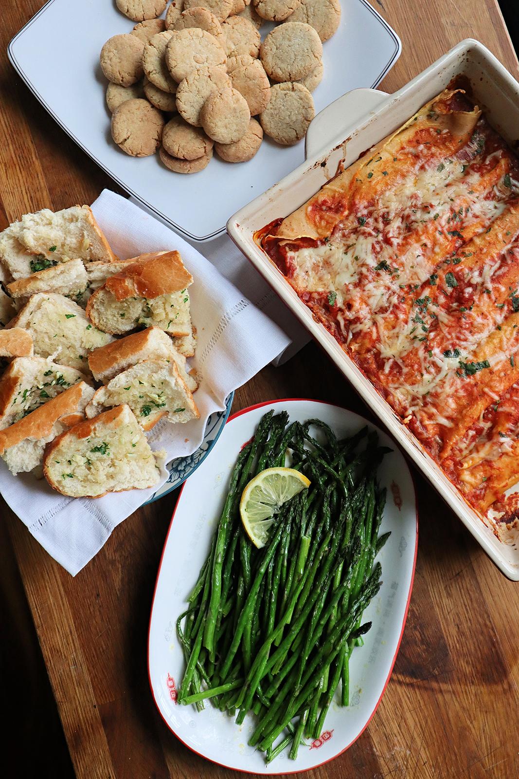 This budget dinner for four includes crepe-like homemade cannelloni, garlic bread, roasted asparagus, and lemon crinkles for dessert. (Gretchen McKay/Pittsburgh Post-Gazette/TNS/TNS)