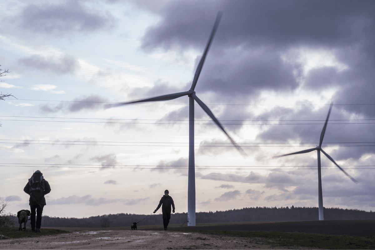 People walking their dogs at Hook Moor Wind Farm, near Leeds, England, on Dec. 21, 2023. (Danny Lawson/PA Wire)