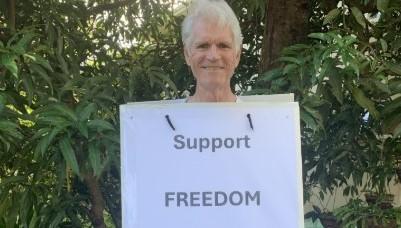 Activist Drew Hutton wearing a billboard in support of women's rights. The co-founder of the Australian Greens and founder of the Queensland Greens, is now at odds with the party he founded over his support of women's rights. He remains active. (Courtesy of Drew Hutton)