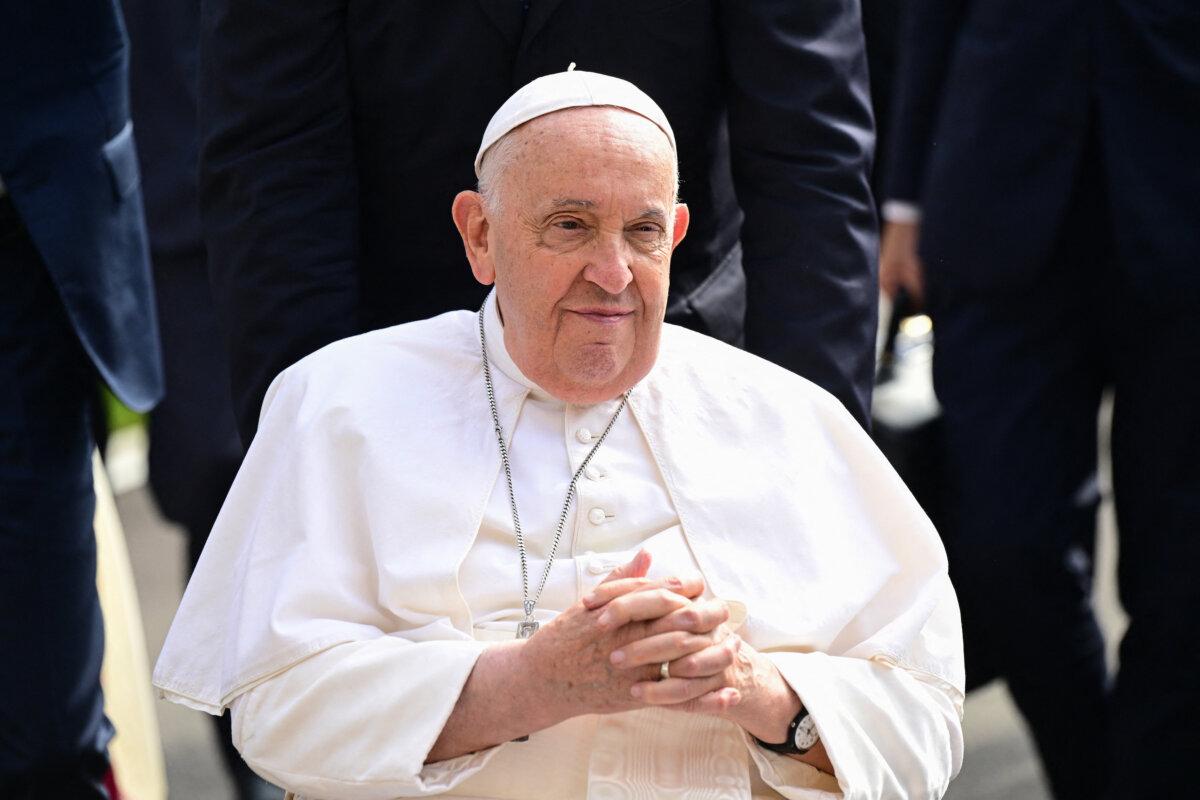 Pope Francis arrives for a visit to Saint Theresa's Home, a Catholic nursing home, in Singapore on Sept. 13, 2024. (Tiziana Fabi/AFP via Getty Images)