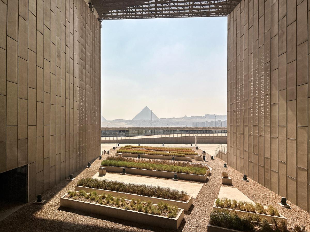 The pyramids can be seen from the Grand Egyptian Museum's main hallway. (Colinmthompson/Shutterstock)