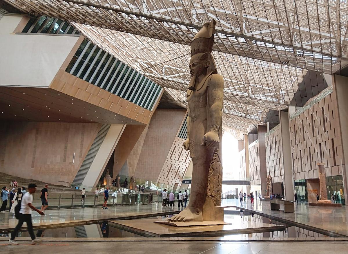 A showcase of thousands of years of dynastic Egypt is on display on the grand staircase inside the Grand Egyptian Museum on April 25, 2025. (Autumn Spredemann/The Epoch Times)