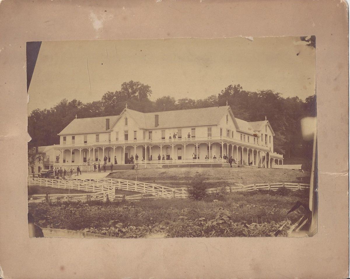 The original French Lick Springs Hotel, circa 1880s. The structure was made of wood and burned down in 1897. (Public domain)