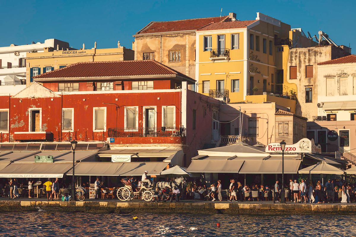 The Venetian Harbor of Chania is one of the most well-preserved of its kind in the Mediterranean, featuring a 16th-century lighthouse, dockyard buildings, and Ottoman-era architecture. (Milamai/Moment/Getty Images)