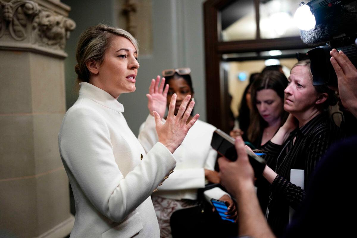 Minister of Industry Mélanie Joly speaks to journalists as she arrives for a meeting of the federal cabinet in West Block on Parliament Hill in Ottawa on May 14, 2025. (The Canadian Press/Justin Tang)