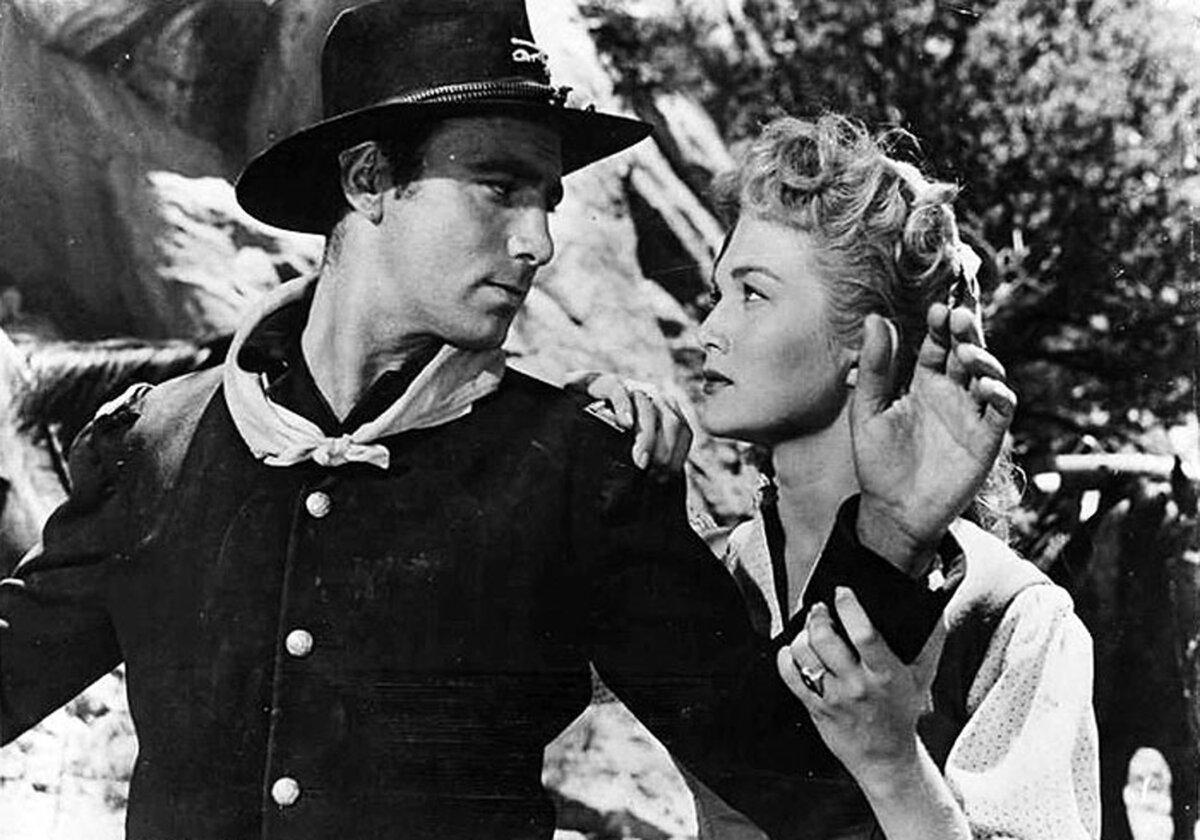 Lt. Rickey (Scott Forbes) is engaged to Johanna Carter (Patrice Wymore), in “Rocky Mountain.” (Warner Bros.)