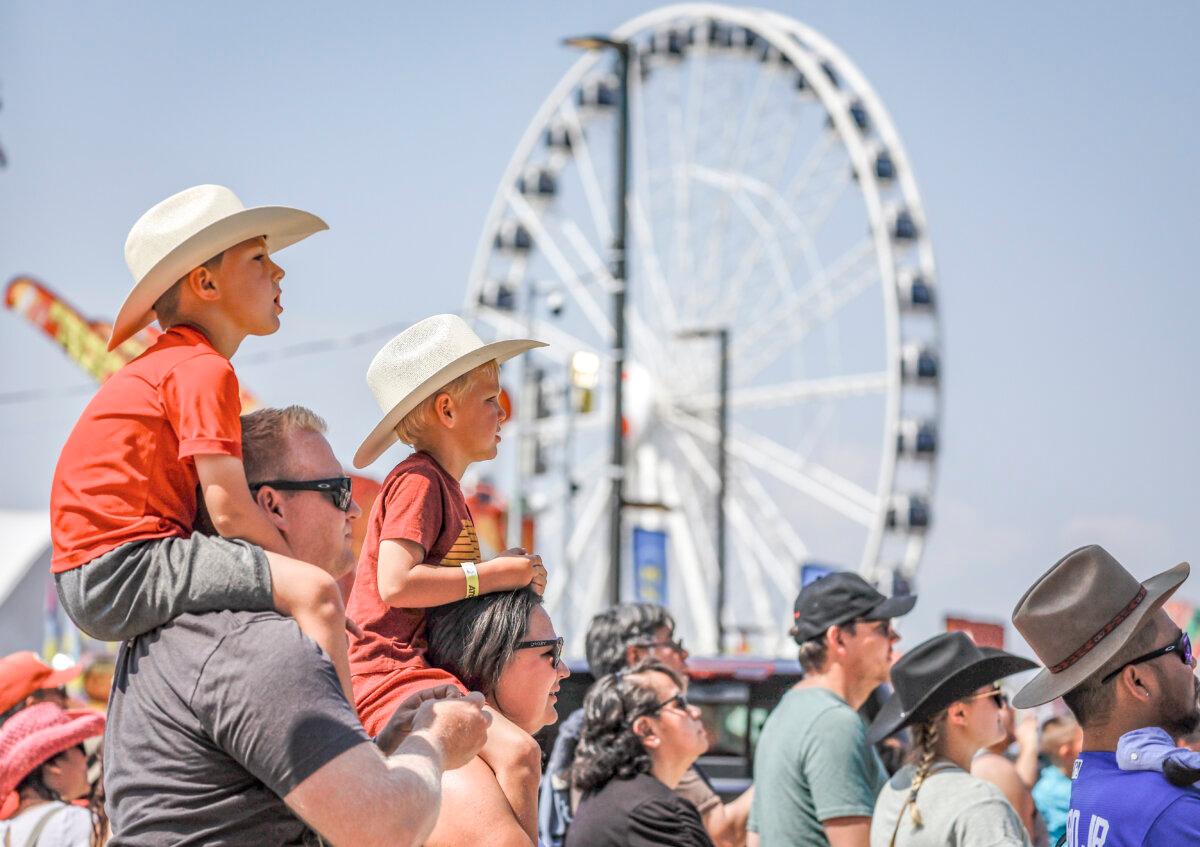 Crowds attend Family Day at the Calgary Stampede in Calgary on July 9, 2023. (The Canadian Press/Jeff McIntosh)