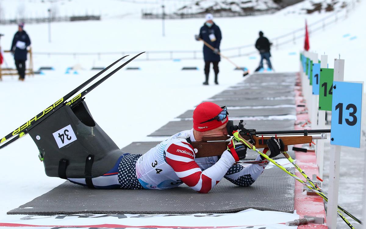Each biathlon event involves skiing and shooting. Here, Cnossen shoots from the prone stage in the Men's Sprint Sitting 6km Biathlon during the World Para Snow Sports Championships at Birkebeineren Ski Stadium, Lillehammer, Norway, on Jan. 15, 2022. (Alex Livesey/Getty Images)