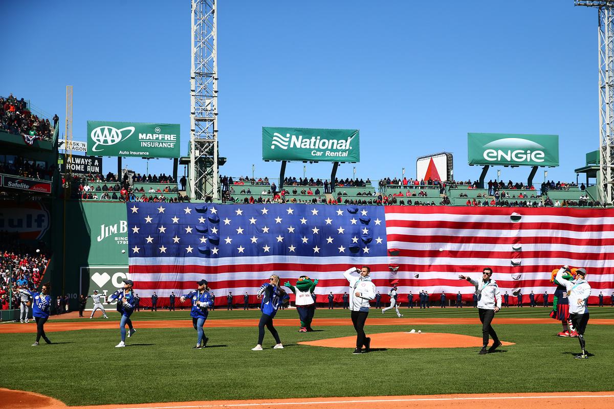 Cnossen (R) joins other gold and silver medalists to throw out the first pitch for a Red Sox game at Fenway Park in Boston, Massachusetts, on April 5, 2018. (Maddie Meyer/Getty Images)