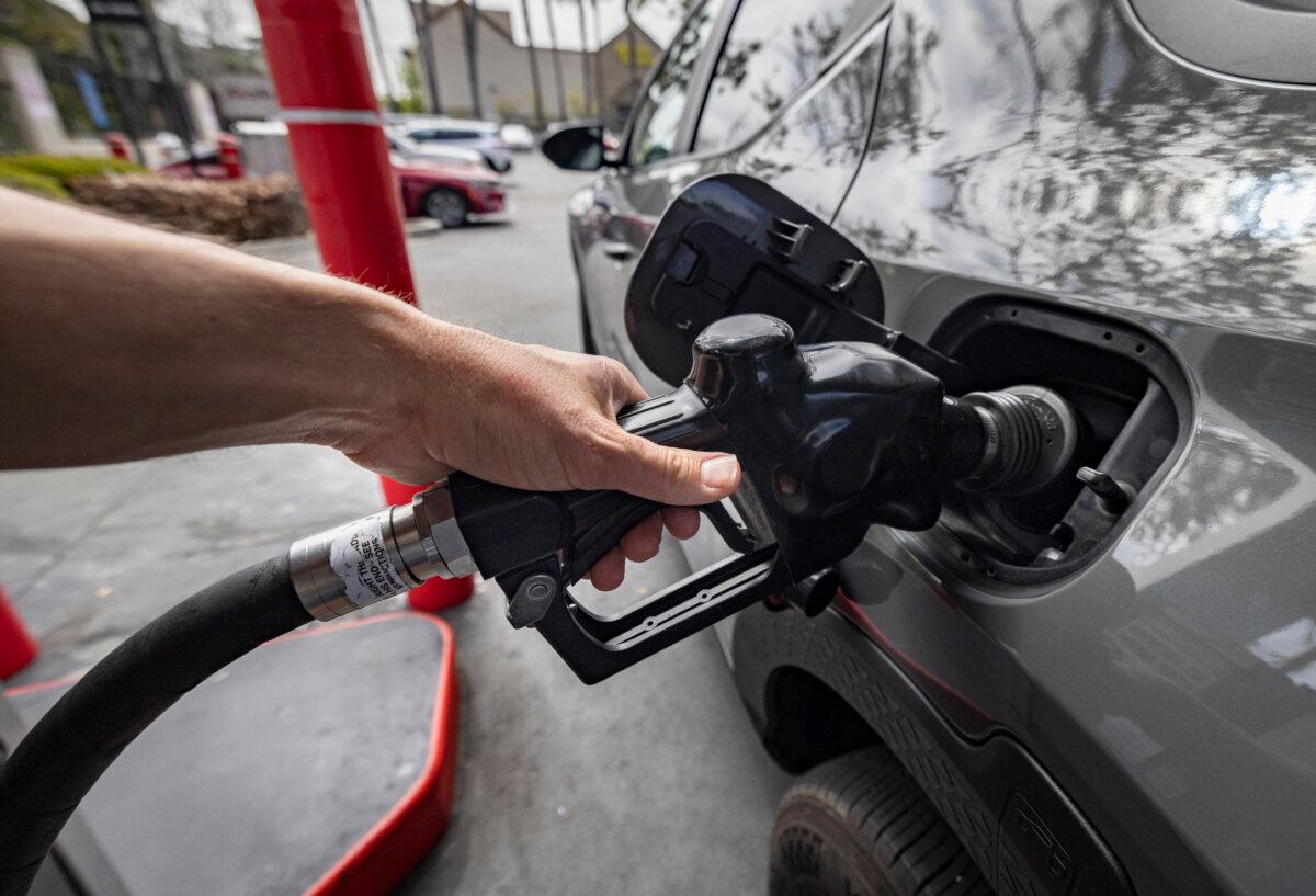 Customers use a gas station in Inglewood, Calif., on March 25, 2025. Starting Oct. 2, California retailers can sell the E15 blend, which is expected to reduce gas prices. (John Fredricks/The Epoch Times)