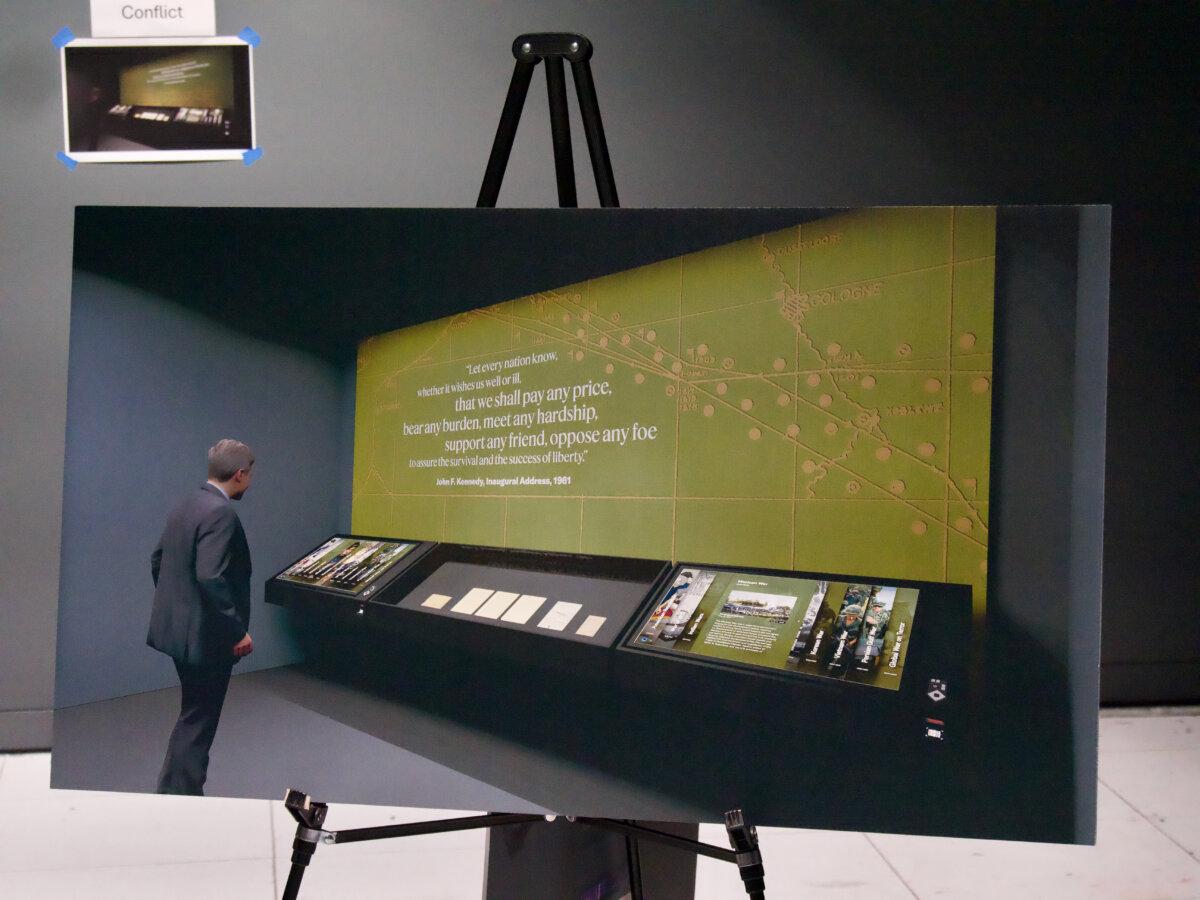 A poster shows how the Crisis and Conflict room in the new exhibit will look, as seen on the tour at the National Archives in Washington, on June 4, 2025. (Travis Gillmore/The Epoch Times)