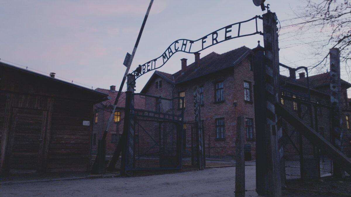 The front gates of the Auschwitz concentration camp. (The Last Twins)