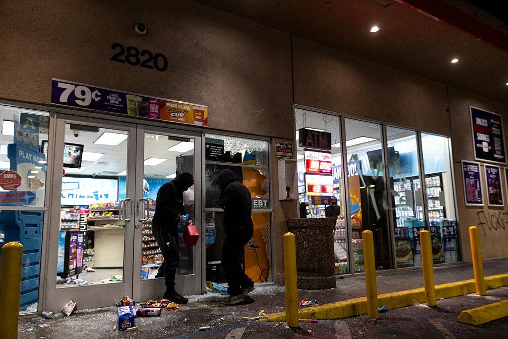 Looters break into a gas station's marketplace in the Compton neighborhood of Los Angeles, California, on June 8, 2025. (Etienne Laurent/AFP via Getty Images)