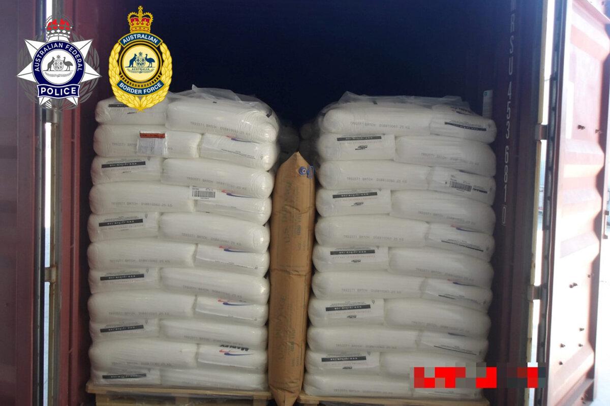 Australian Border Force Officers opened the container to reveal pallets of polyethylene, a legal product used for packaging, with the cocaine sitting on top, wrapped in black plastic. (Courtesy of ABF and AFP)