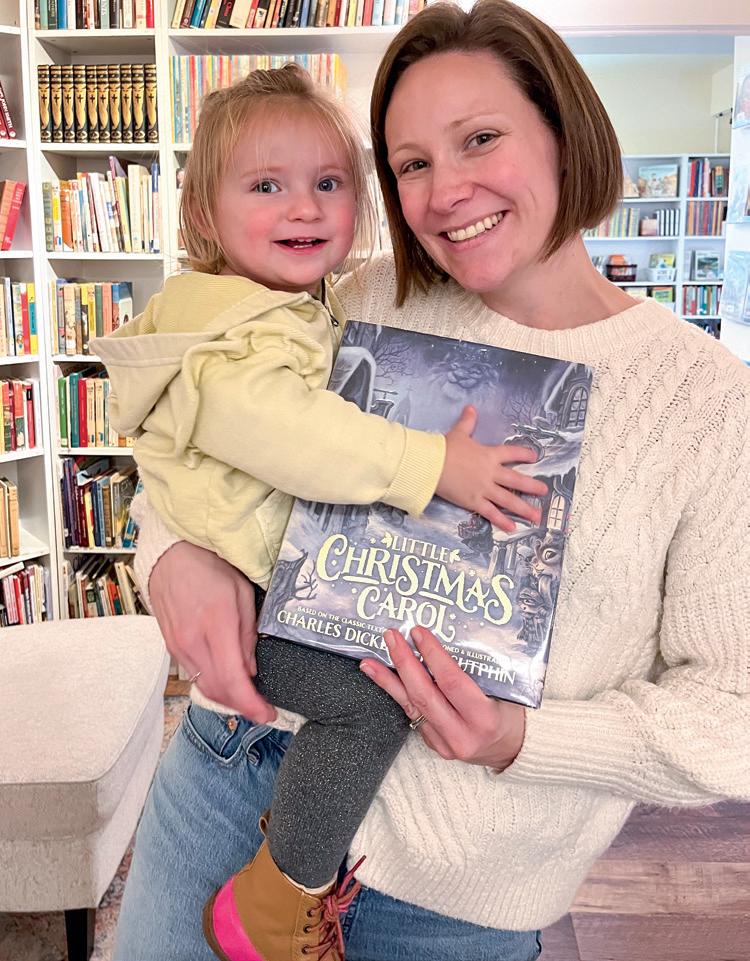 A mother and daughter enjoying reading time at Masarik's library. (Courtesy of Sara Masarik)