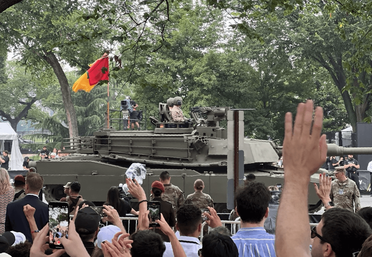 Spectators cheer as they watch the parade marking the 250th birthday of the Army in Washington on June 14, 2025. (Epoch Times)